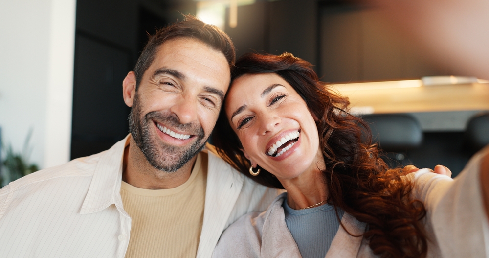 Smiling couple taking a selfie together