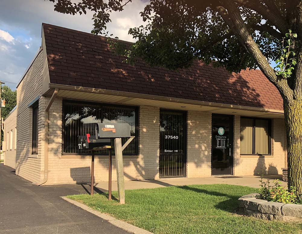 Exterior of the Enhance Family Dental office building on Gratiot Avenue