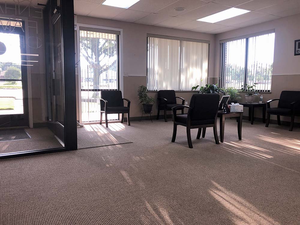 Bright reception and waiting area inside Enhance Family Dental